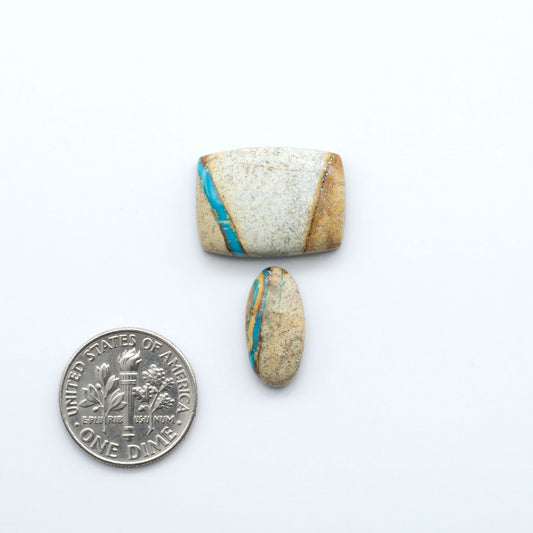 Royston Turquoise cabochons are famous for their distinctive matrix and unique green and blue hues, making them a favored option among jewelry designers.