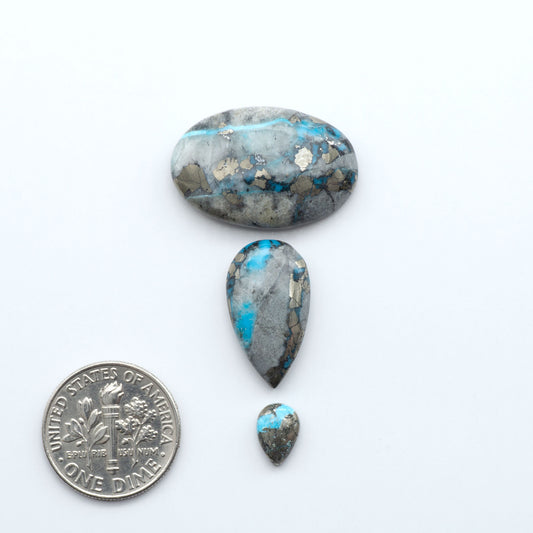 Royston Turquoise cabochons are famous for their distinctive matrix and unique green and blue hues, making them a favored option among jewelry designers.