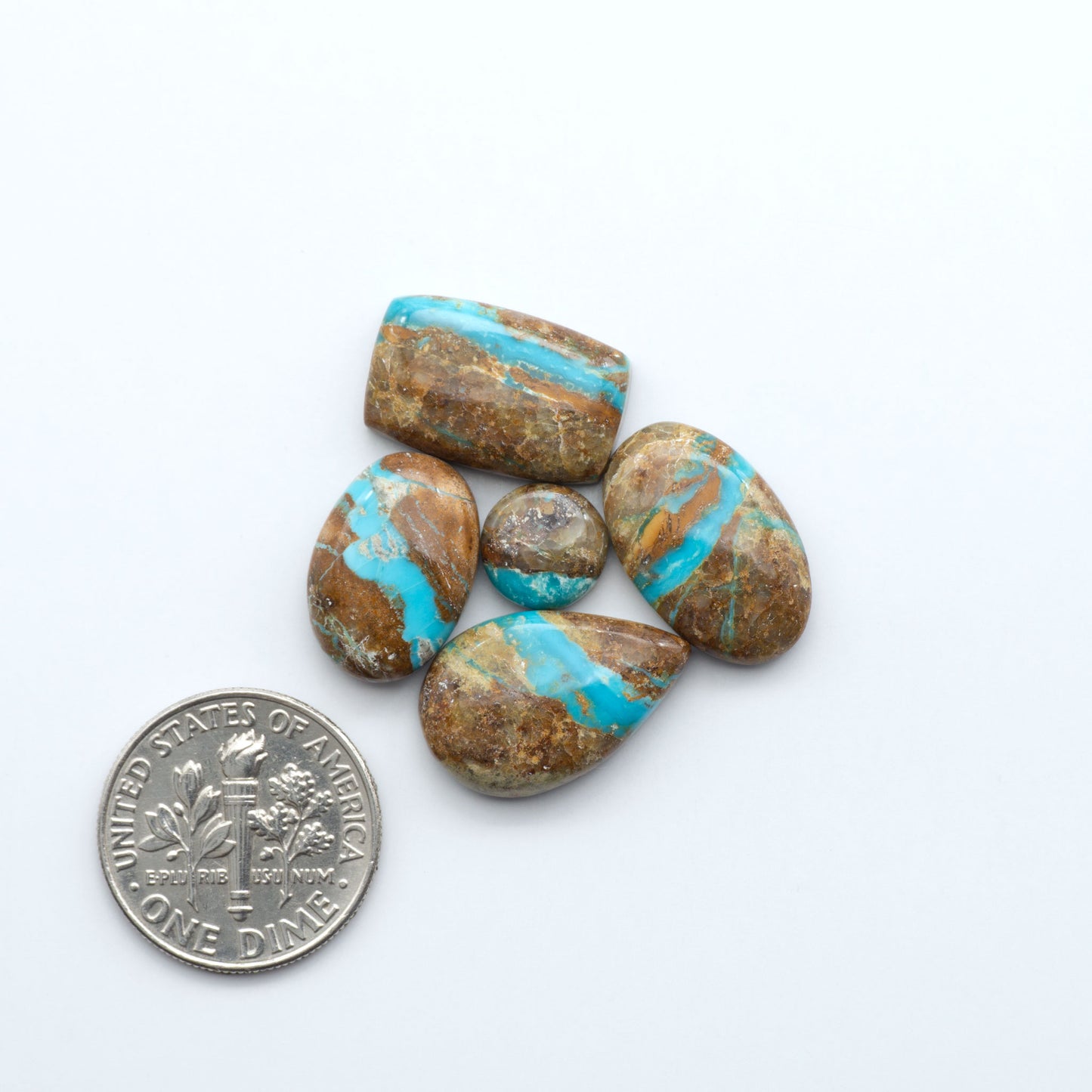 Royston Turquoise cabochons are famous for their distinctive matrix and unique green and blue hues, making them a favored option among jewelry designers.