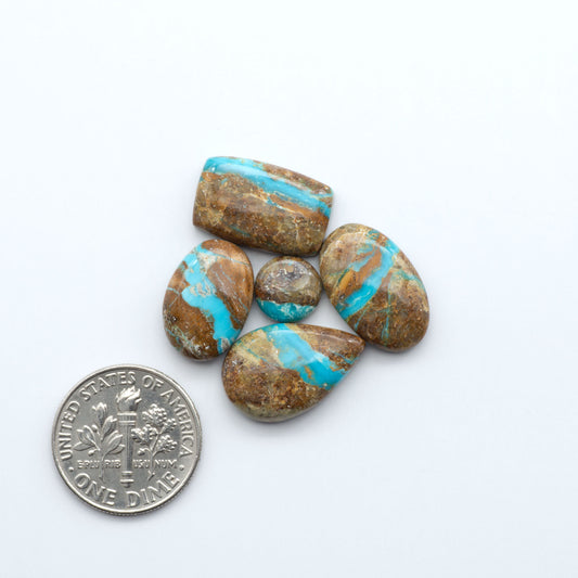 Royston Turquoise cabochons are famous for their distinctive matrix and unique green and blue hues, making them a favored option among jewelry designers.