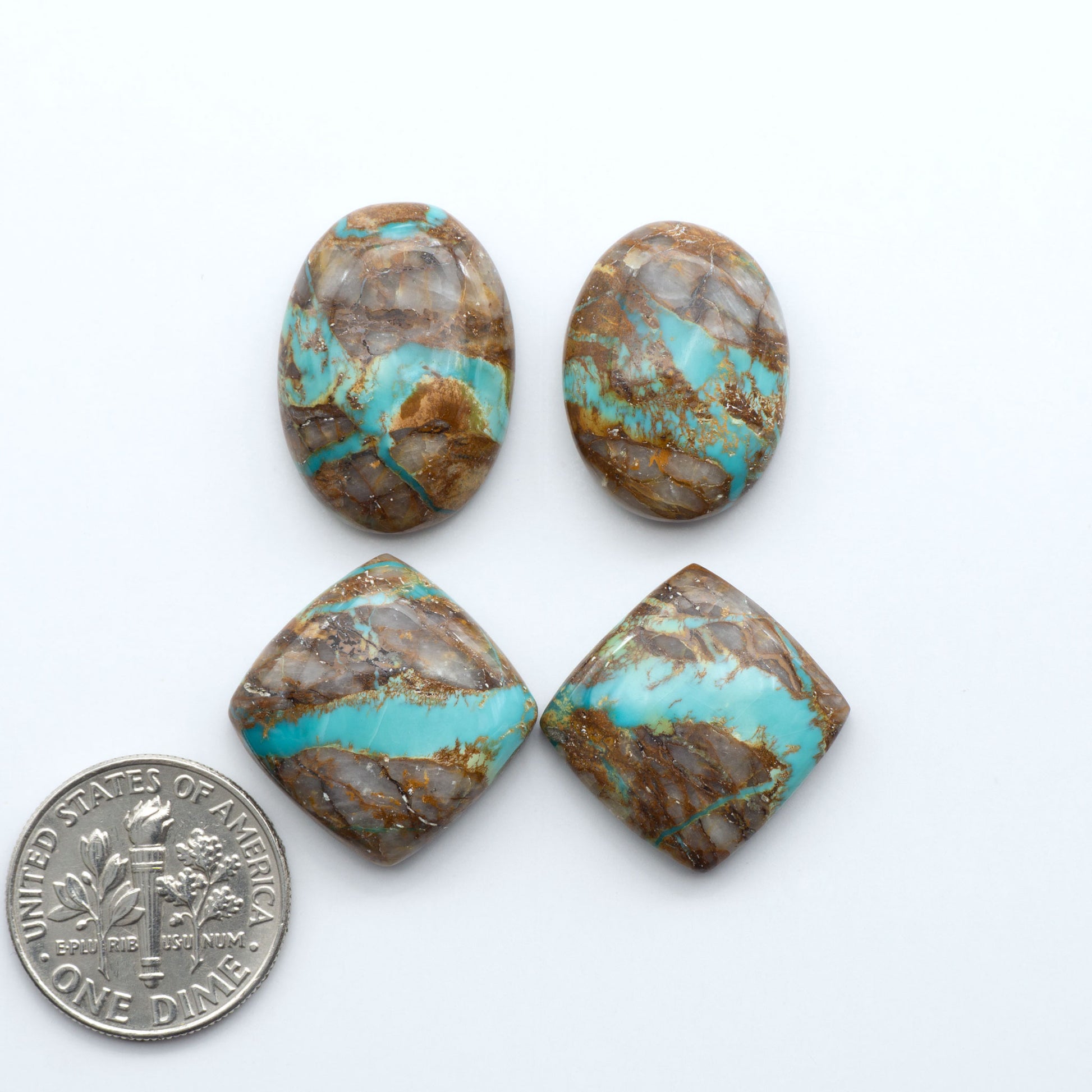 Royston Turquoise cabochons are famous for their distinctive matrix and unique green and blue hues, making them a favored option among jewelry designers.