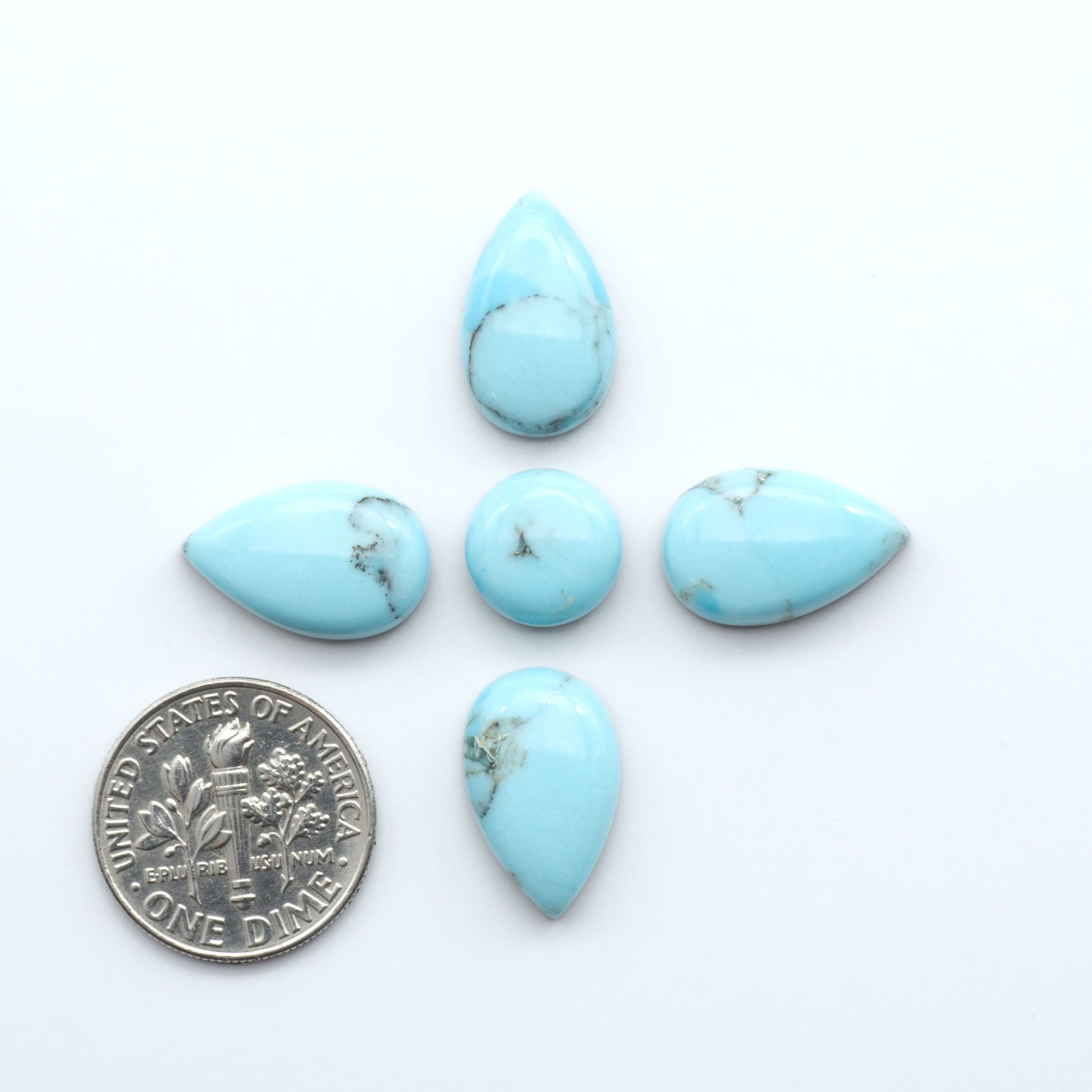 Enhance your jewelry designs with Pressed Turquoise Nugget Cabochons. Crafted from composite materials they add a captivating touch to your creations.