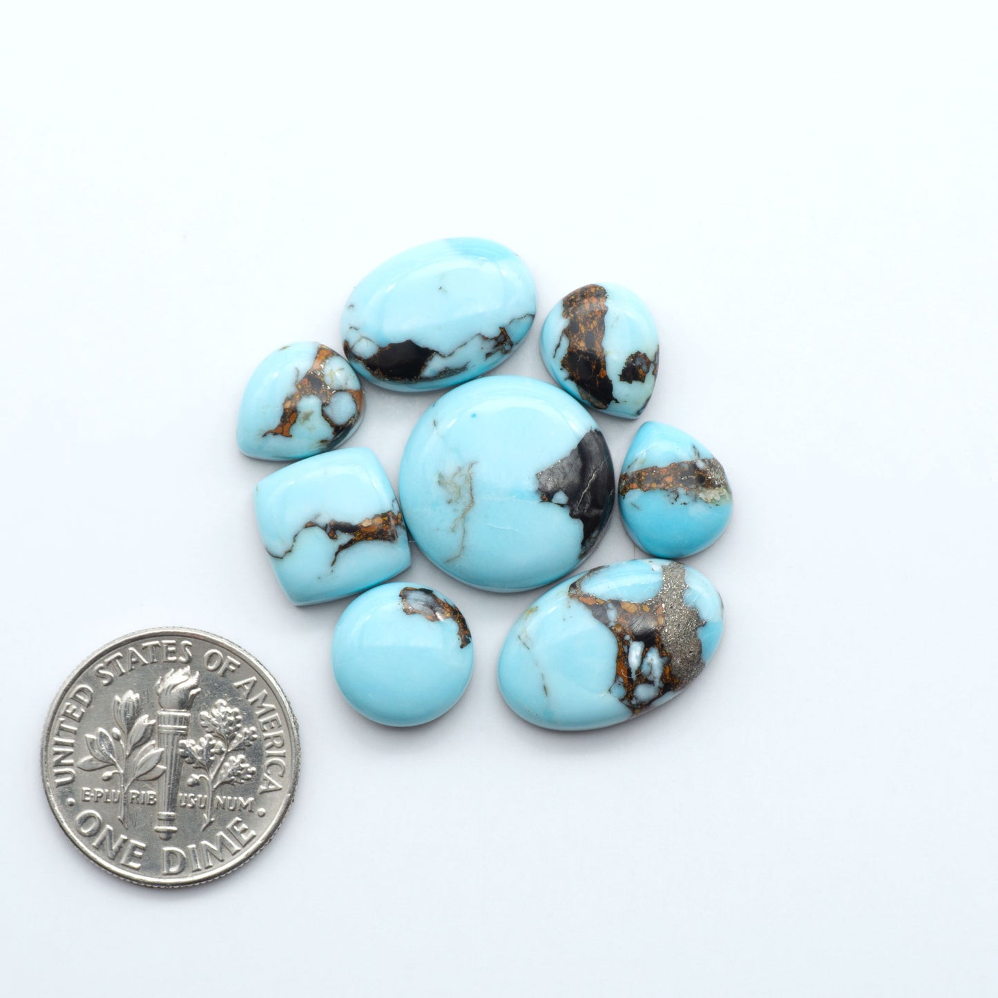 Enhance your jewelry designs with Pressed Turquoise Nugget Cabochons. Crafted from composite materials they add a captivating touch to your creations.