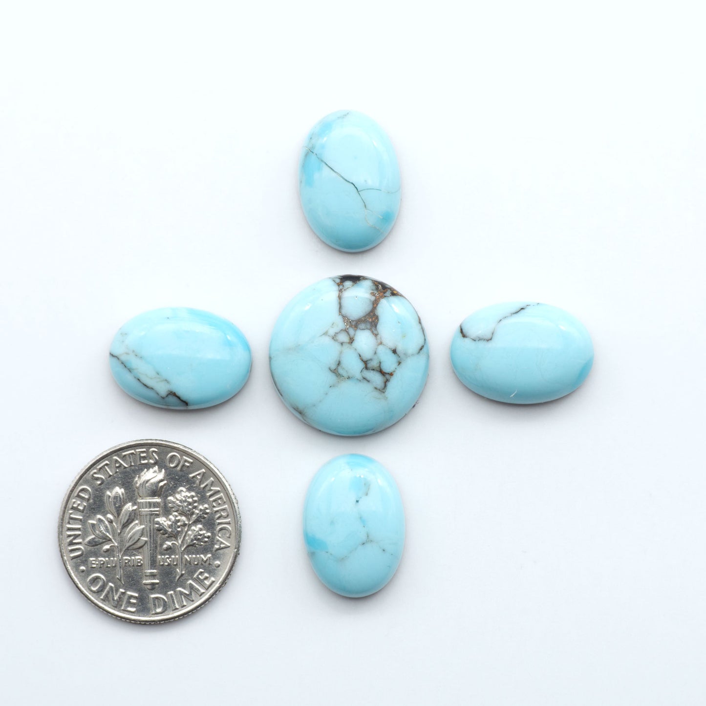 Enhance your jewelry designs with Pressed Turquoise Nugget Cabochons. Crafted from composite materials they add a captivating touch to your creations.