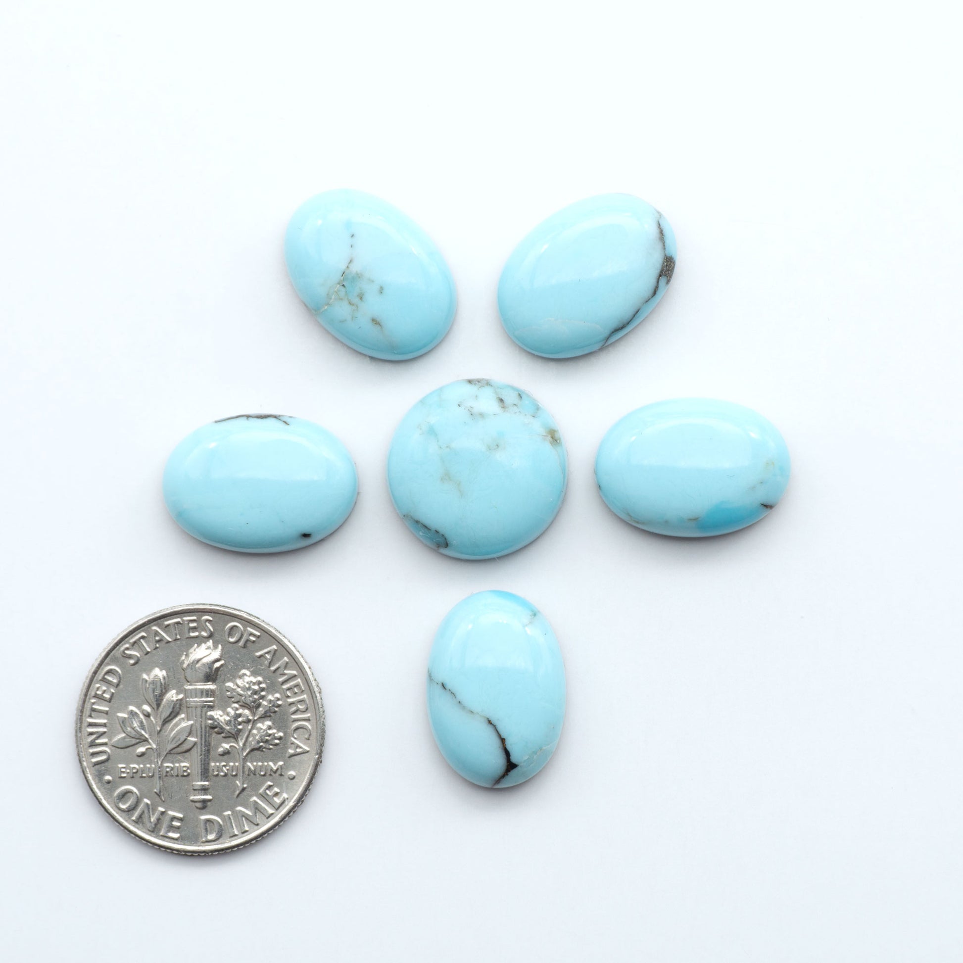 Enhance your jewelry designs with Pressed Turquoise Nugget Cabochons. Crafted from composite materials they add a captivating touch to your creations.