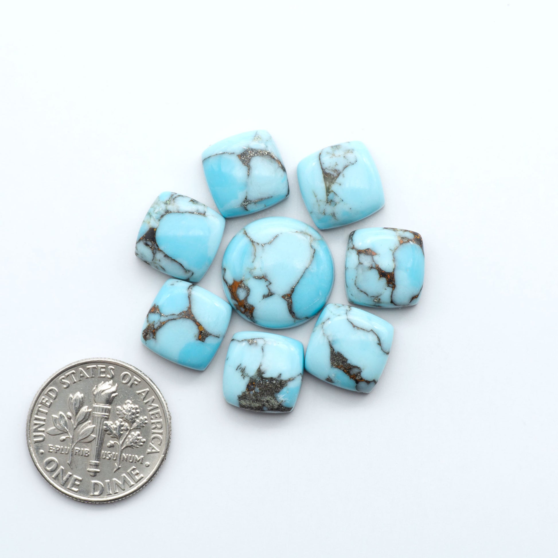 Enhance your jewelry designs with Pressed Turquoise Nugget Cabochons. Crafted from composite materials they add a captivating touch to your creations.
