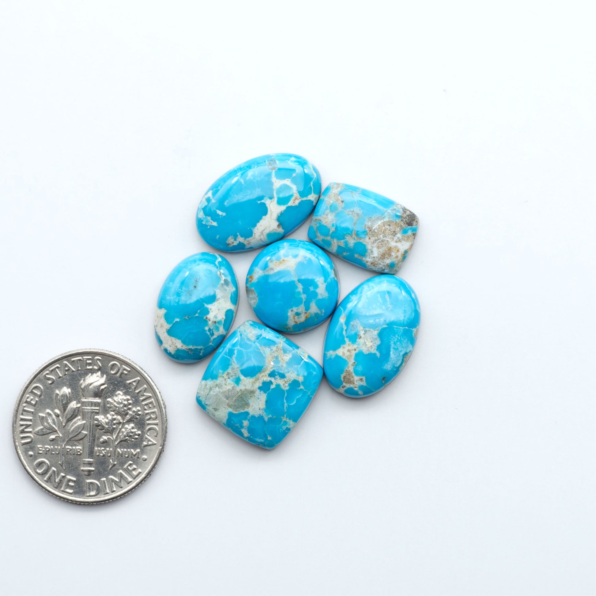 Sierra Bella Turquoise cabochons feature rich blue-green color and natural matrix variation. Ideal for silversmiths, jewelers, and custom jewelry designs.