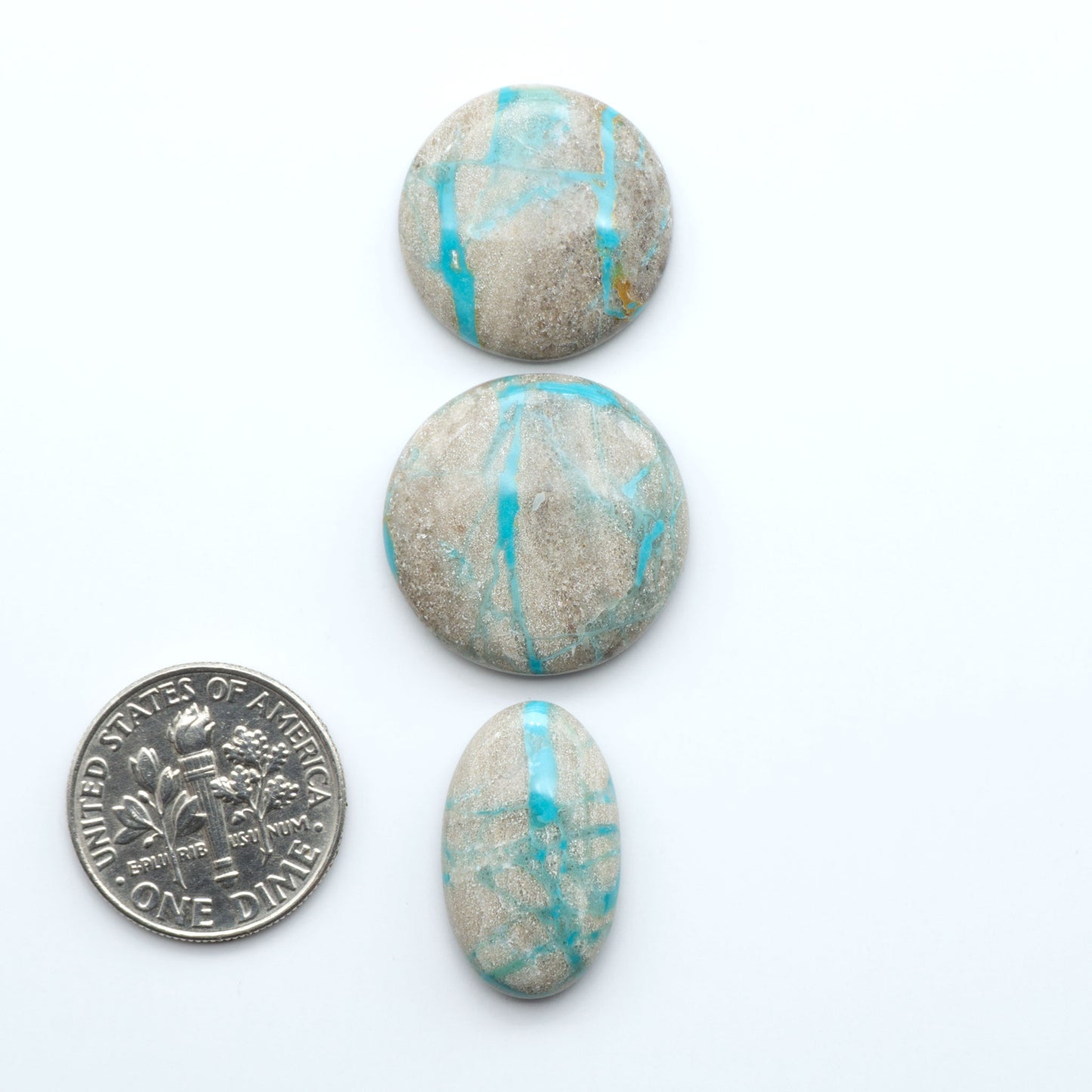 Carico Lake Turquoise cabochons with vibrant aqua-blue to turquoise tones and natural matrix, ideal for rings, pendants, and artisan jewelry.