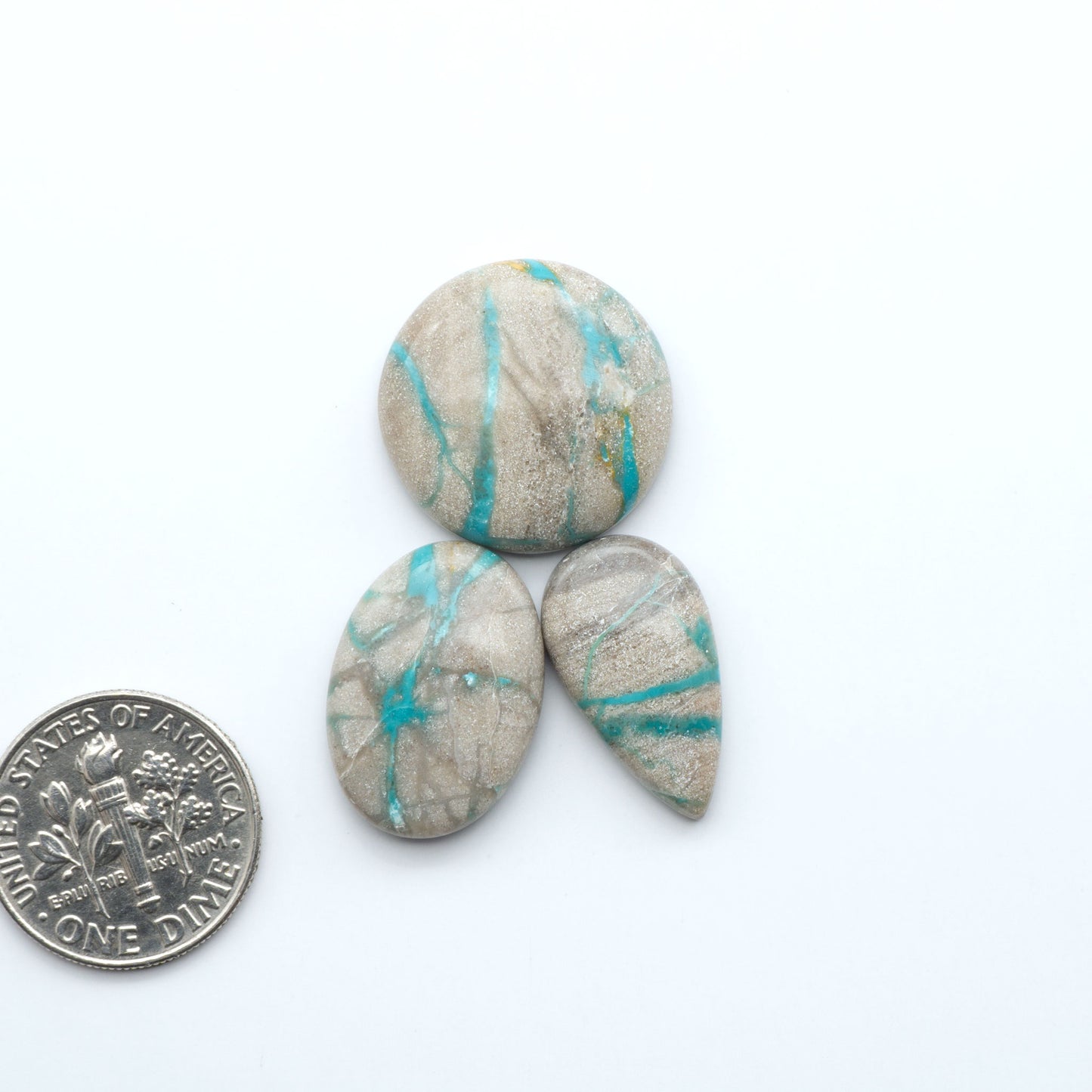 Carico Lake Turquoise cabochons with vibrant aqua-blue to turquoise tones and natural matrix, ideal for rings, pendants, and artisan jewelry.