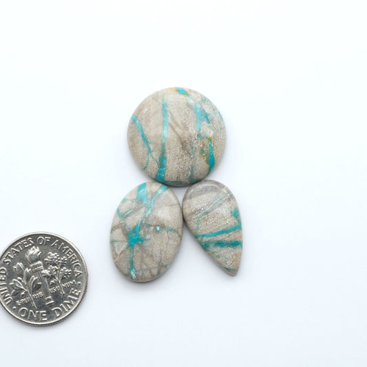 Carico Lake Turquoise cabochons with vibrant aqua-blue to turquoise tones and natural matrix, ideal for rings, pendants, and artisan jewelry.