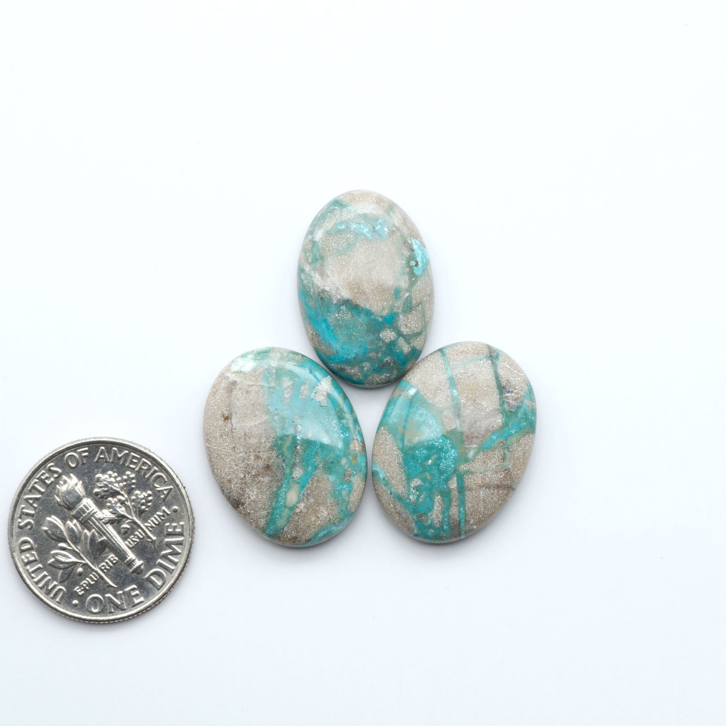 Carico Lake Turquoise cabochons with vibrant aqua-blue to turquoise tones and natural matrix, ideal for rings, pendants, and artisan jewelry.