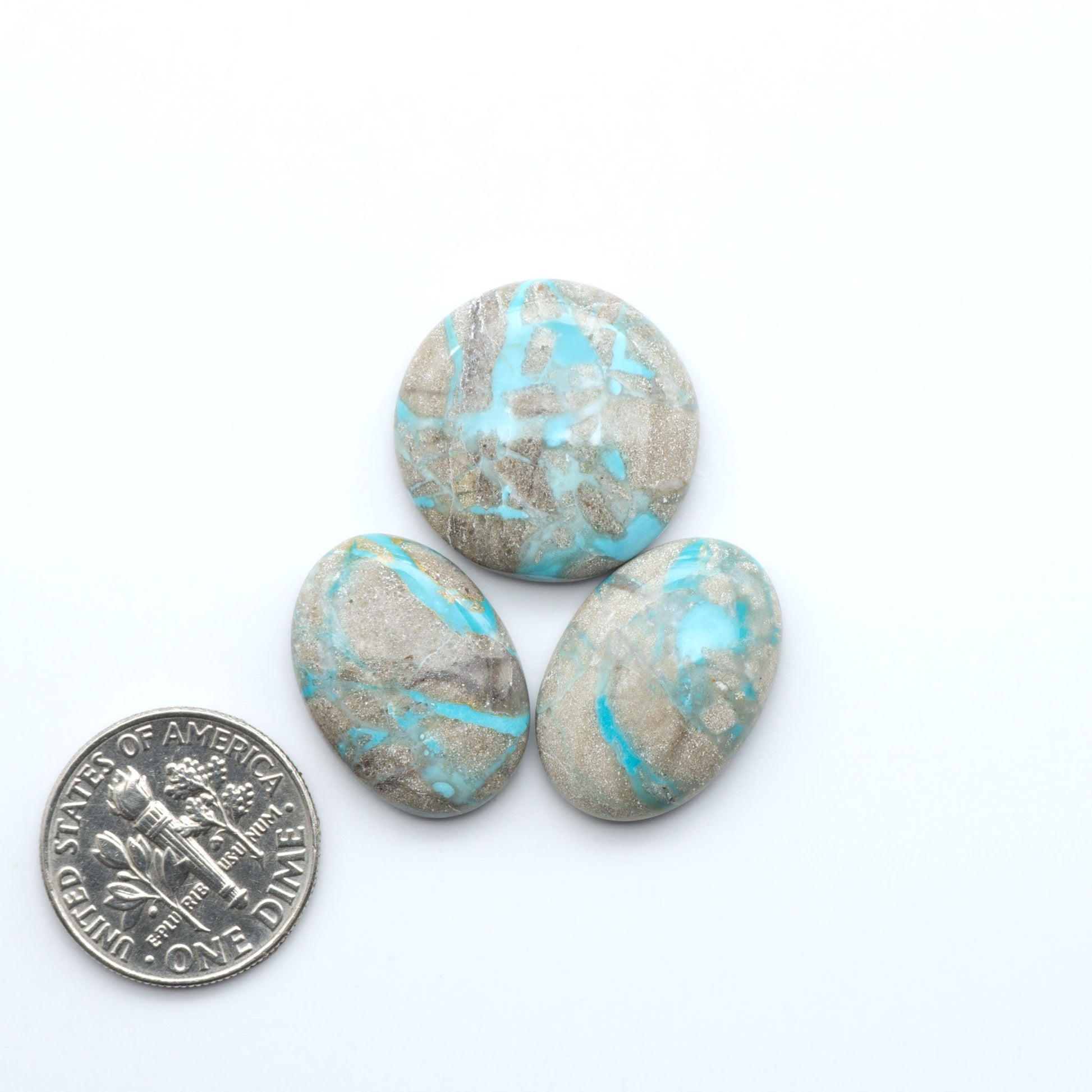 Carico Lake Turquoise cabochons with vibrant aqua-blue to turquoise tones and natural matrix, ideal for rings, pendants, and artisan jewelry.