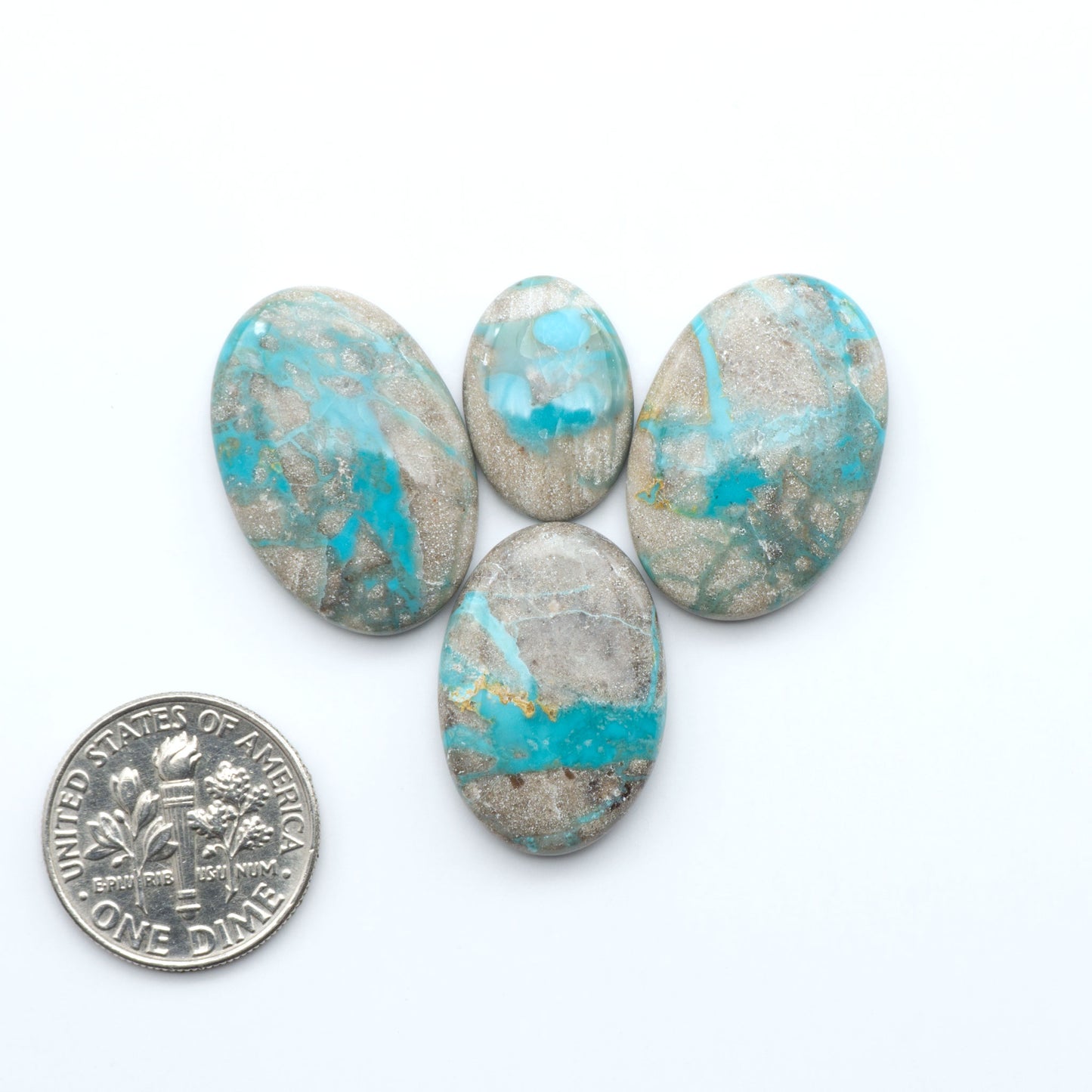 Carico Lake Turquoise cabochons with vibrant aqua-blue to turquoise tones and natural matrix, ideal for rings, pendants, and artisan jewelry.
