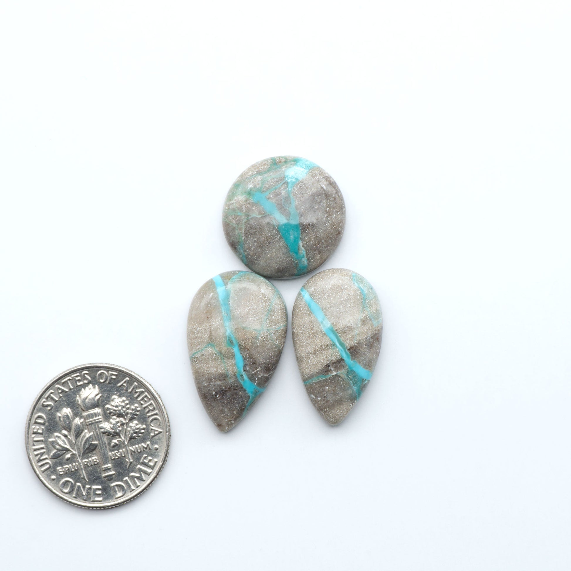 Carico Lake Turquoise cabochons with vibrant aqua-blue to turquoise tones and natural matrix, ideal for rings, pendants, and artisan jewelry.