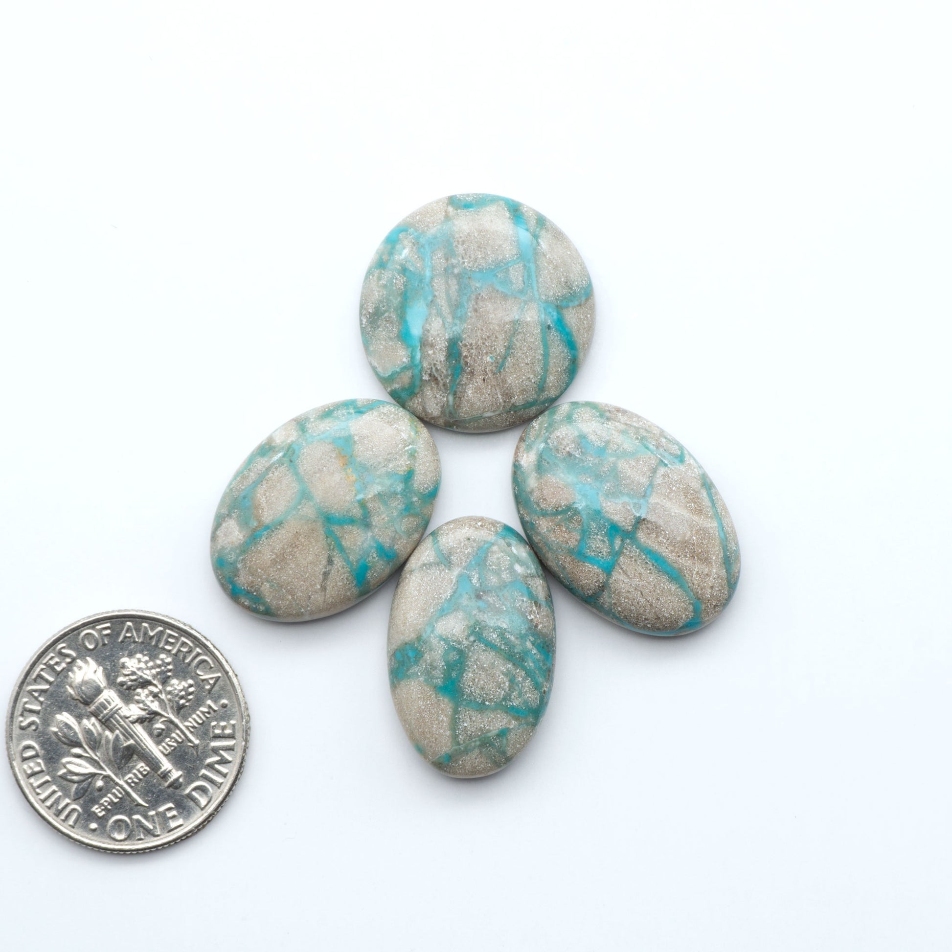 Carico Lake Turquoise cabochons with vibrant aqua-blue to turquoise tones and natural matrix, ideal for rings, pendants, and artisan jewelry.