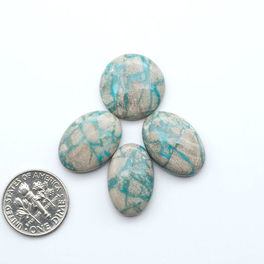 Carico Lake Turquoise cabochons with vibrant aqua-blue to turquoise tones and natural matrix, ideal for rings, pendants, and artisan jewelry.
