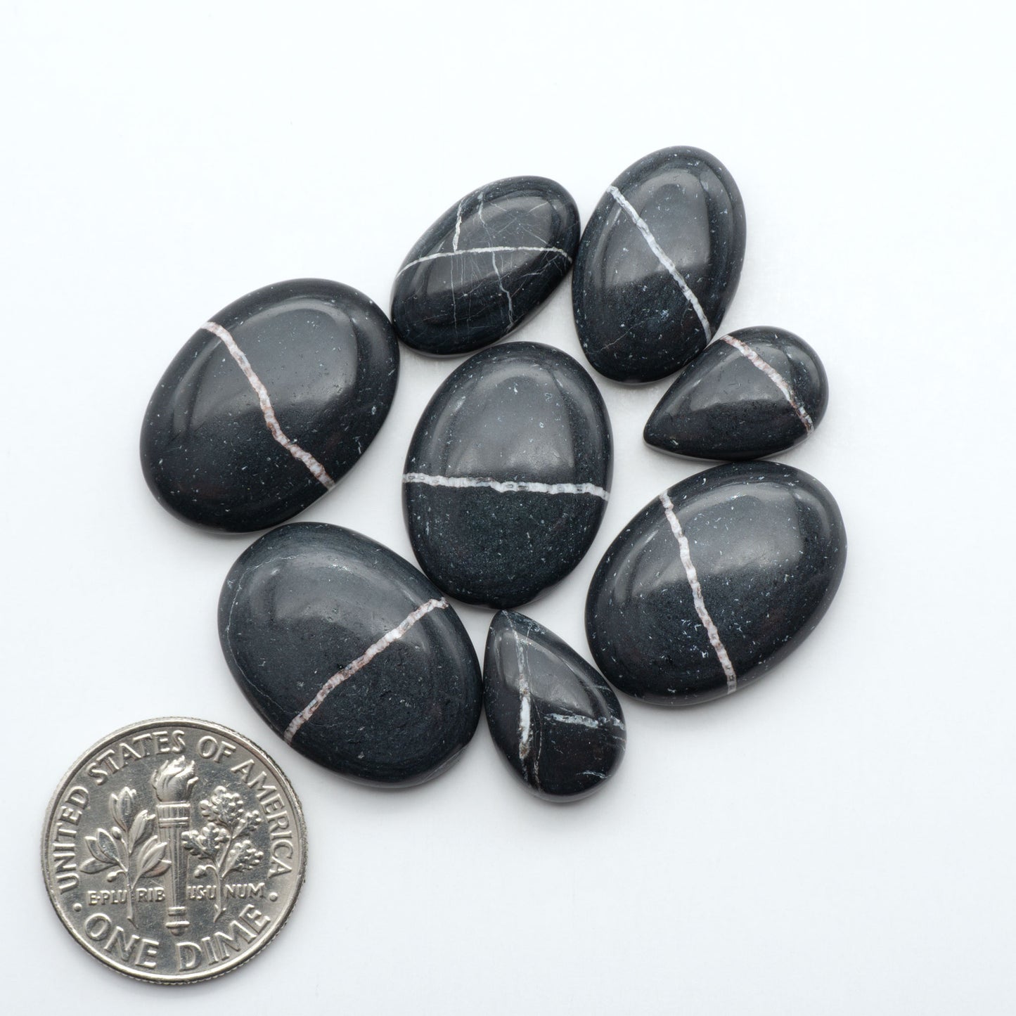 Natural White Buffalo Stone Cabochons are semi-precious gemstones cut into shapes ideal for jewelry-making, making them an excellent choice for artisans.