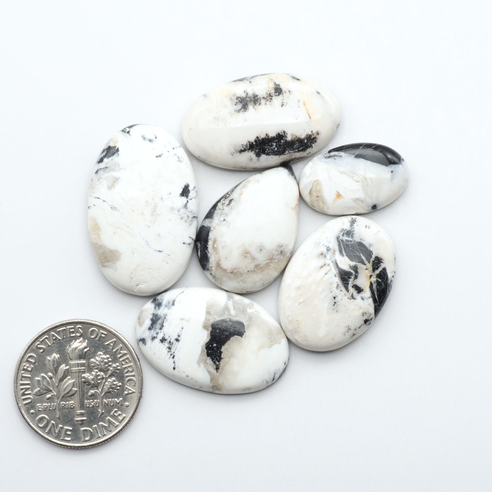 Natural White Buffalo Stone Cabochons are semi-precious gemstones cut into shapes ideal for jewelry-making, making them an excellent choice for artisans.