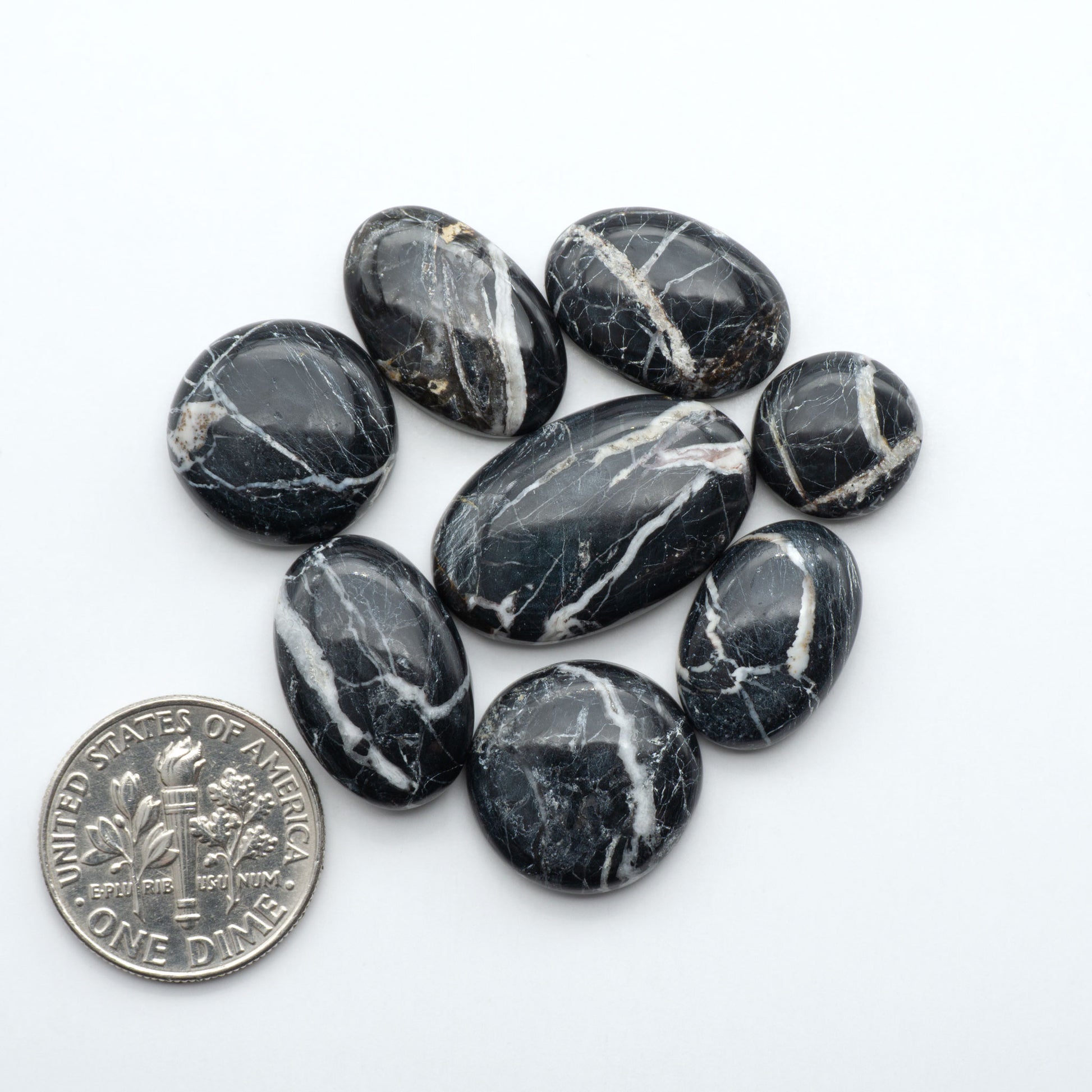 Natural White Buffalo Stone Cabochons are semi-precious gemstones cut into shapes ideal for jewelry-making, making them an excellent choice for artisans.