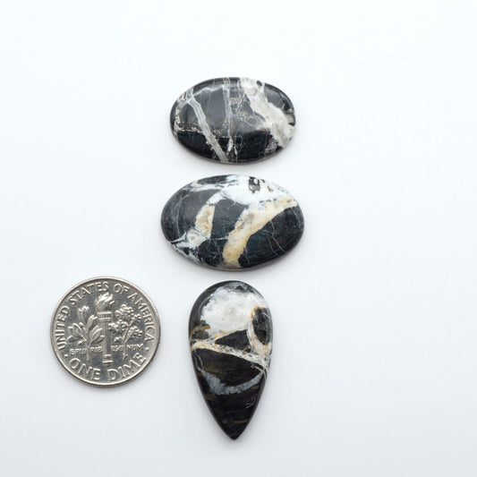 Natural White Buffalo Stone Cabochons are semi-precious gemstones cut into shapes ideal for jewelry-making, making them an excellent choice for artisans.