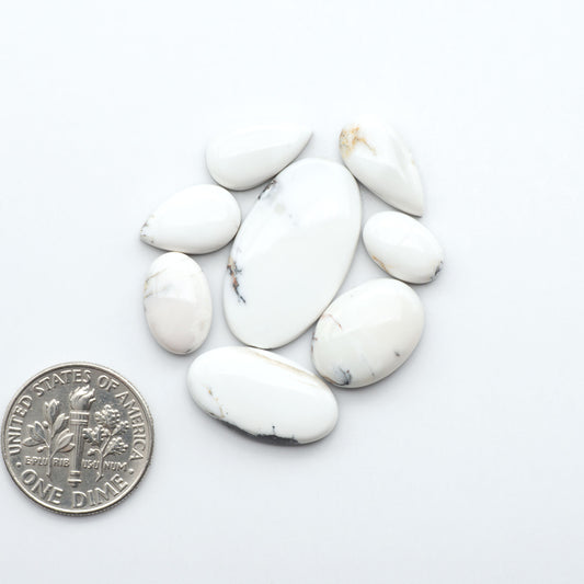 Natural White Buffalo Stone Cabochons are semi-precious gemstones cut into shapes ideal for jewelry-making, making them an excellent choice for artisans.