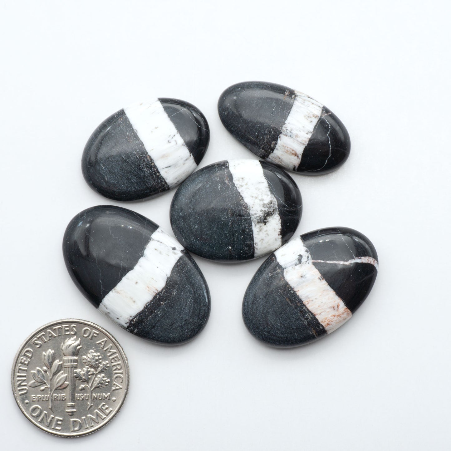 Natural White Buffalo Stone Cabochons are semi-precious gemstones cut into shapes ideal for jewelry-making, making them an excellent choice for artisans.