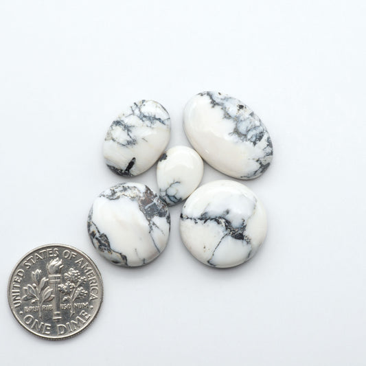 Natural White Buffalo Stone Cabochons are semi-precious gemstones cut into shapes ideal for jewelry-making, making them an excellent choice for artisans.