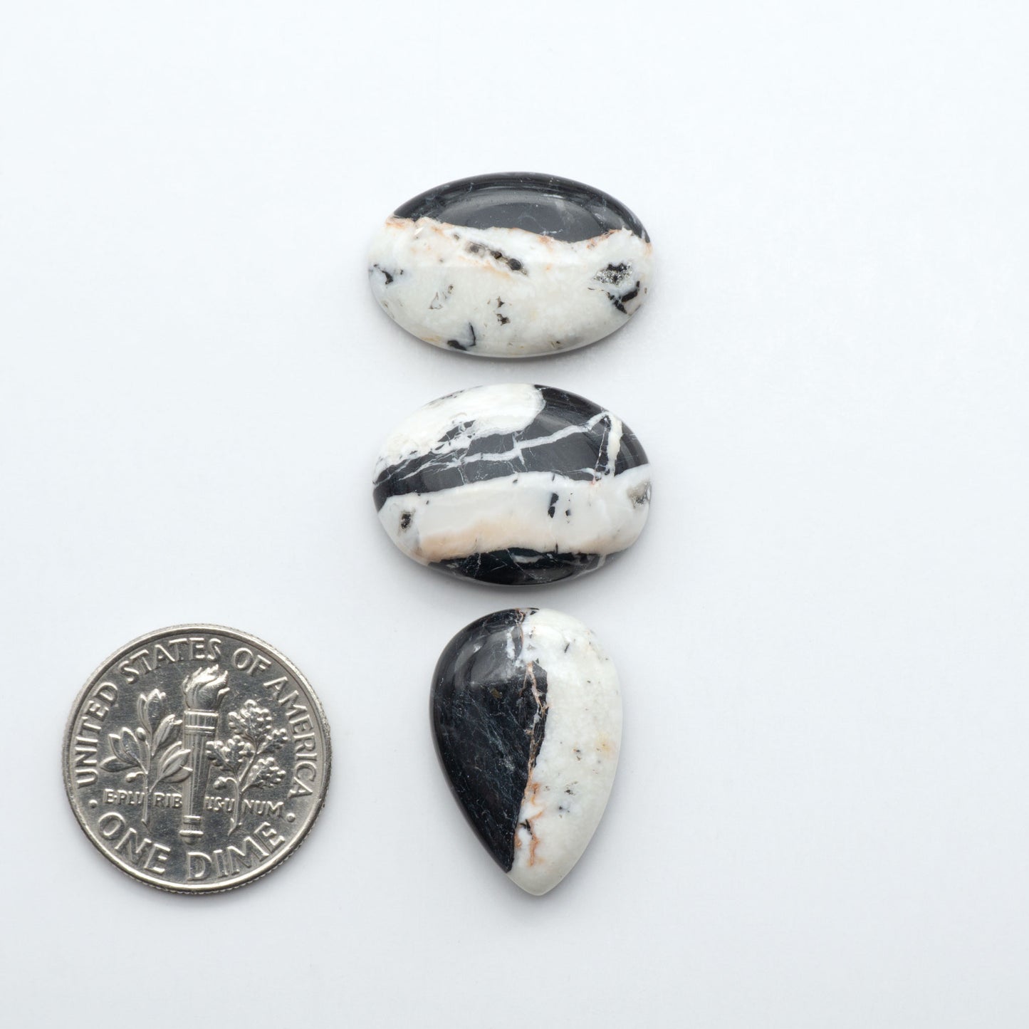 Natural White Buffalo Stone Cabochons are semi-precious gemstones cut into shapes ideal for jewelry-making, making them an excellent choice for artisans.