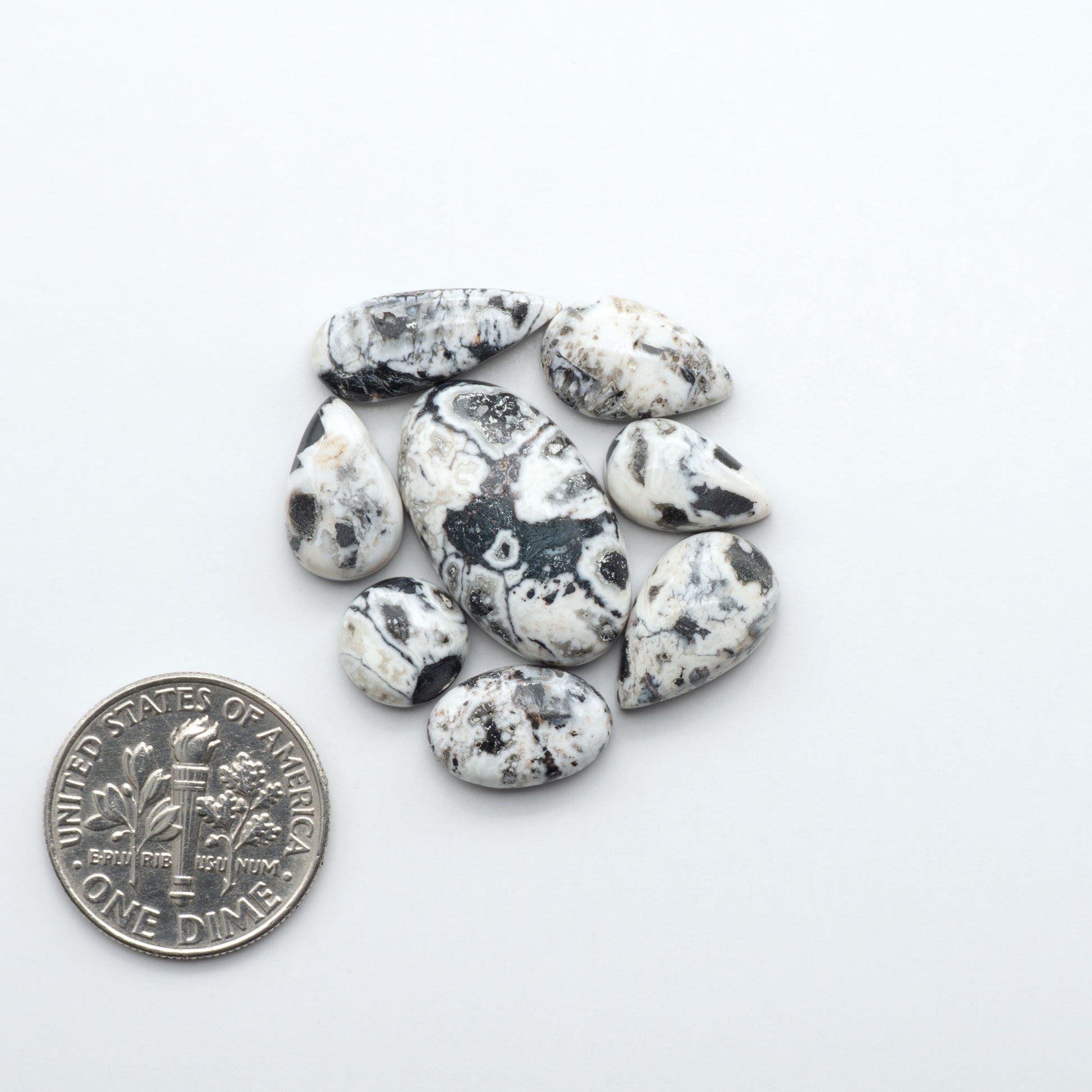 Natural White Buffalo Stone Cabochons are semi-precious gemstones cut into shapes ideal for jewelry-making, making them an excellent choice for artisans.