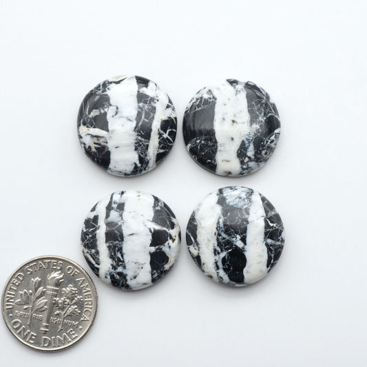 Natural White Buffalo Stone Cabochons are semi-precious gemstones cut into shapes ideal for jewelry-making, making them an excellent choice for artisans.