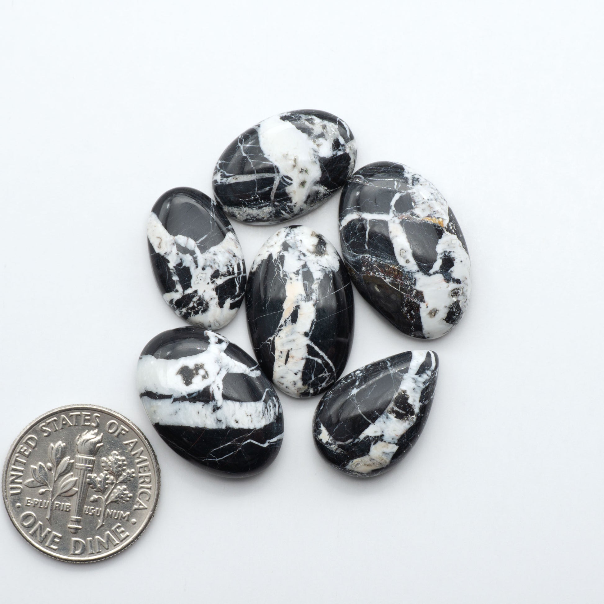 Natural White Buffalo Stone Cabochons are semi-precious gemstones cut into shapes ideal for jewelry-making, making them an excellent choice for artisans.