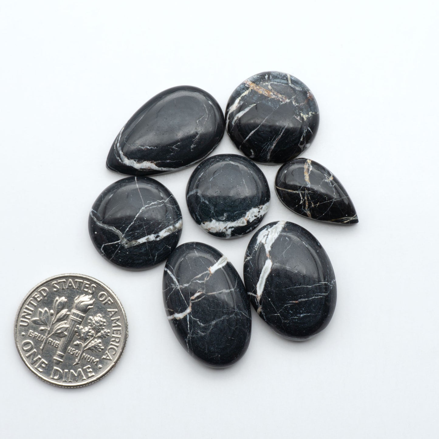 Natural White Buffalo Stone Cabochons are semi-precious gemstones cut into shapes ideal for jewelry-making, making them an excellent choice for artisans.