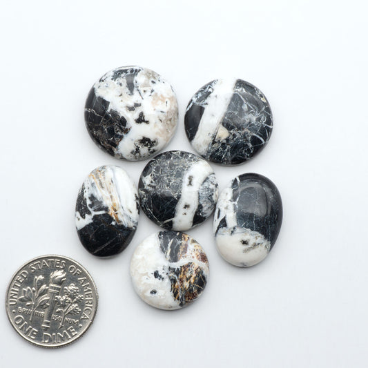 Natural White Buffalo Stone Cabochons are semi-precious gemstones cut into shapes ideal for jewelry-making, making them an excellent choice for artisans.