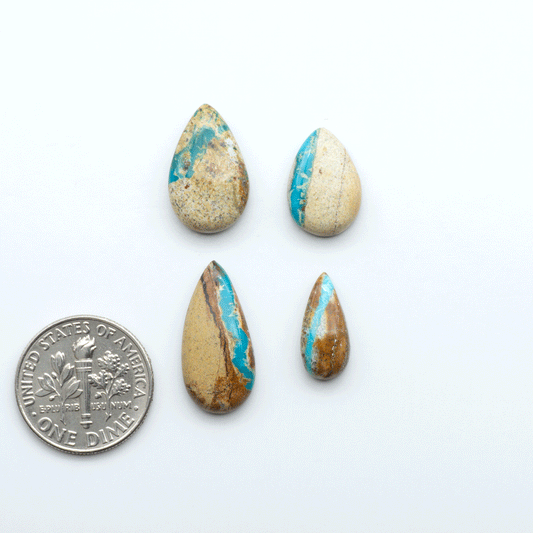 Royston Turquoise cabochons are famous for their distinctive matrix and unique green and blue hues, making them a favored option among jewelry designers.