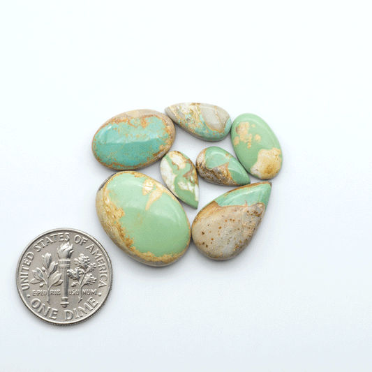 Royston Turquoise cabochons are famous for their distinctive matrix and unique green and blue hues, making them a favored option among jewelry designers.