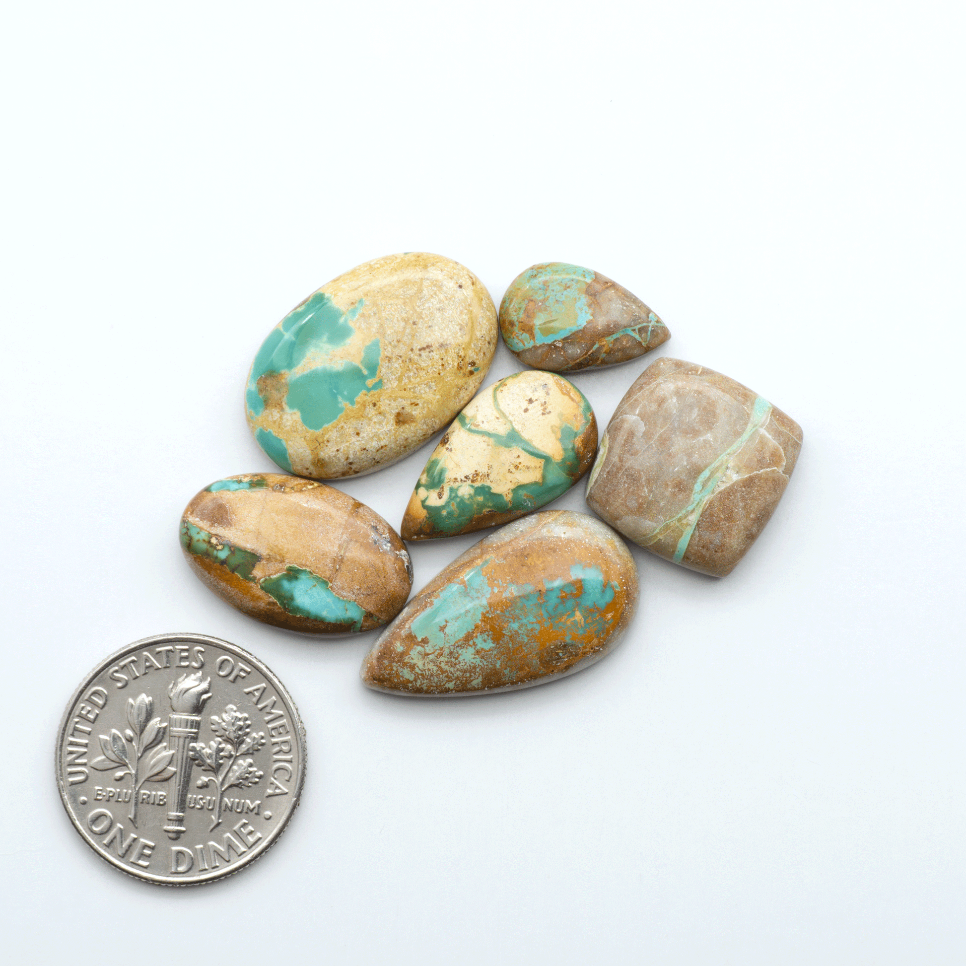 Royston Turquoise cabochons are famous for their distinctive matrix and unique green and blue hues, making them a favored option among jewelry designers.