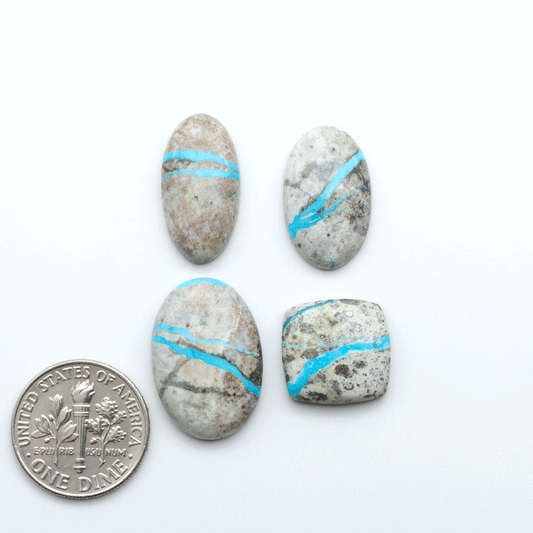 Royston Turquoise cabochons are famous for their distinctive matrix and unique green and blue hues, making them a favored option among jewelry designers.