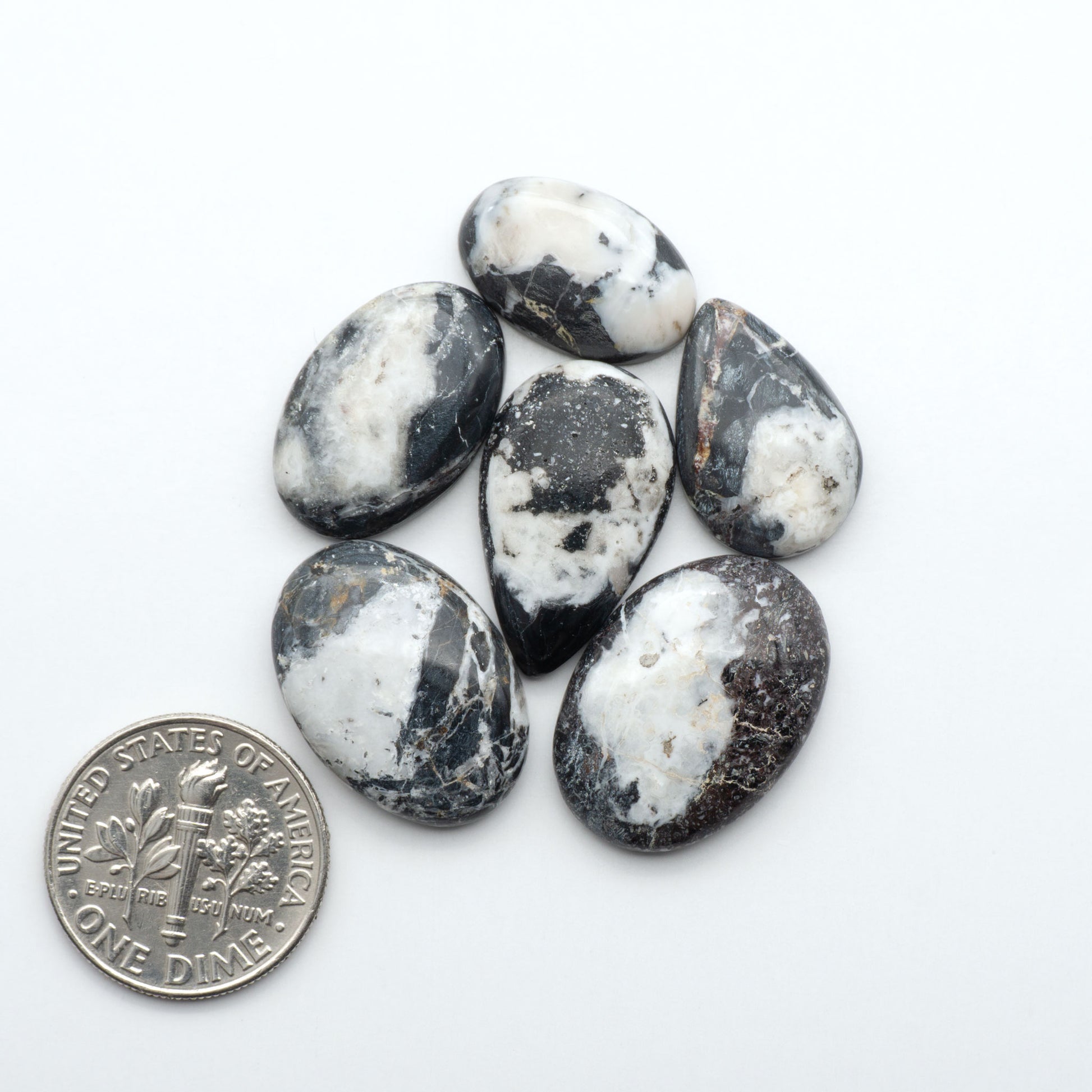 Natural White Buffalo Stone Cabochons are semi-precious gemstones cut into shapes ideal for jewelry-making, making them an excellent choice for artisans.
