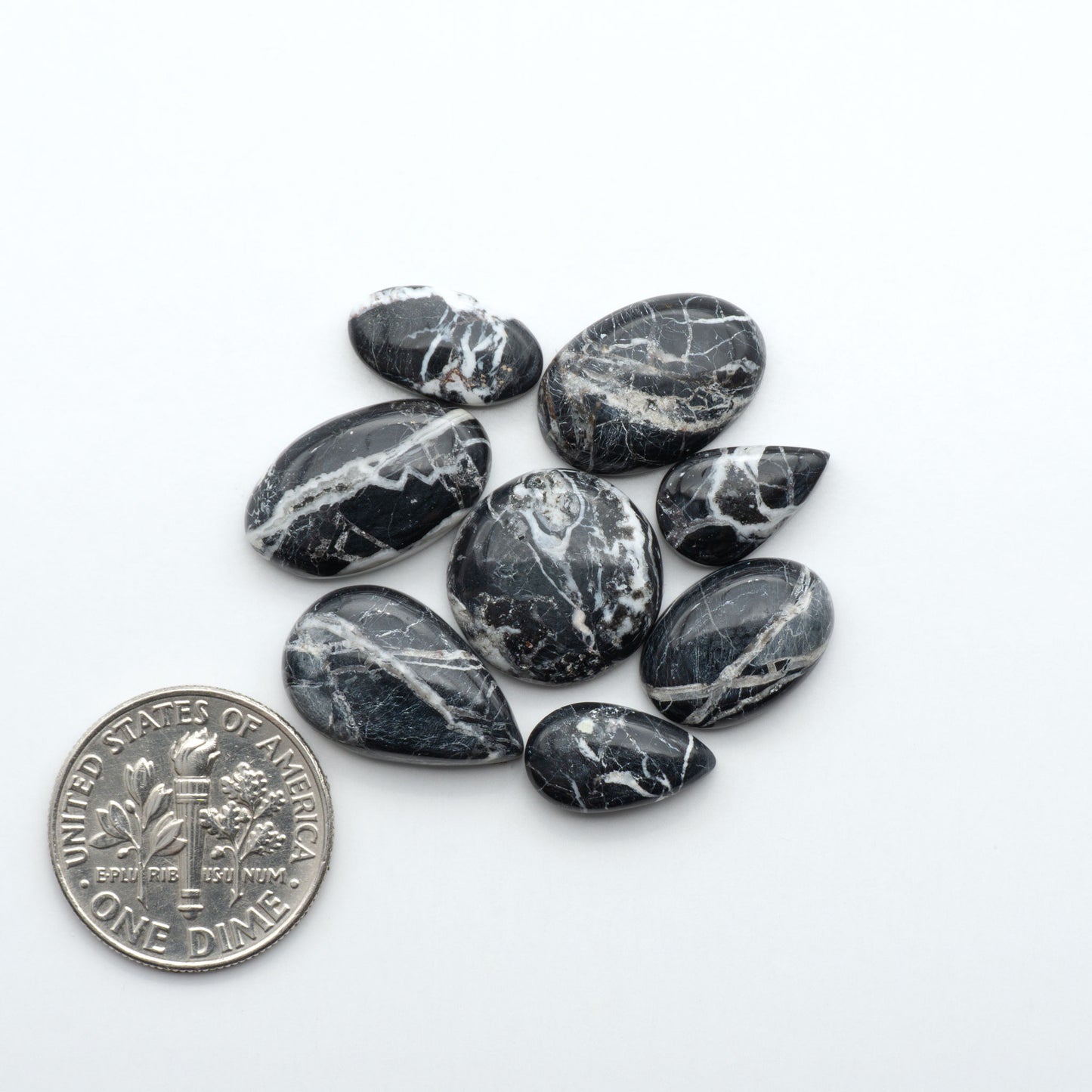 Natural White Buffalo Stone Cabochons are semi-precious gemstones cut into shapes ideal for jewelry-making, making them an excellent choice for artisans.
