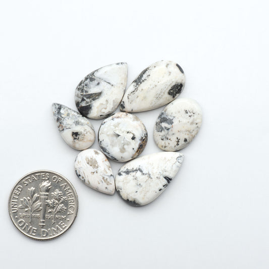 Natural White Buffalo Stone Cabochons are semi-precious gemstones cut into shapes ideal for jewelry-making, making them an excellent choice for artisans.
