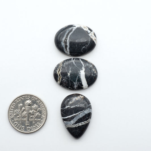 Natural White Buffalo Stone Cabochons are semi-precious gemstones cut into shapes ideal for jewelry-making, making them an excellent choice for artisans.
