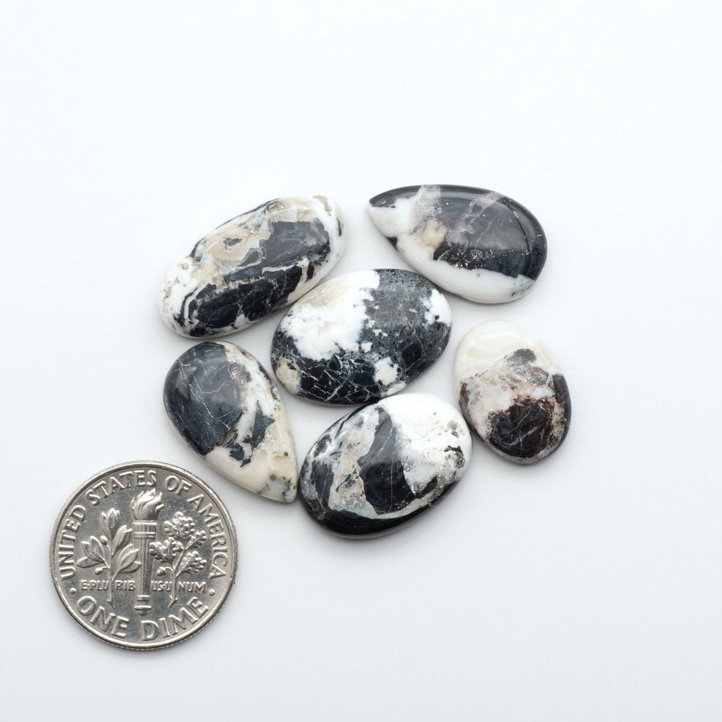 Natural White Buffalo Stone Cabochons are semi-precious gemstones cut into shapes ideal for jewelry-making, making them an excellent choice for artisans.
