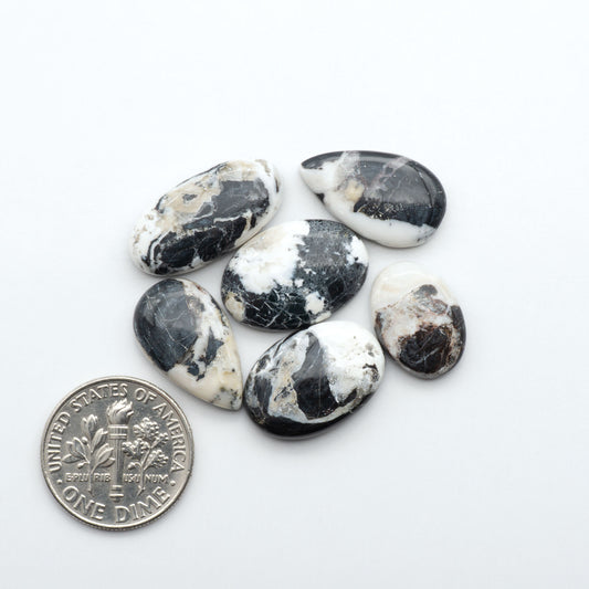 Natural White Buffalo Stone Cabochons are semi-precious gemstones cut into shapes ideal for jewelry-making, making them an excellent choice for artisans.
