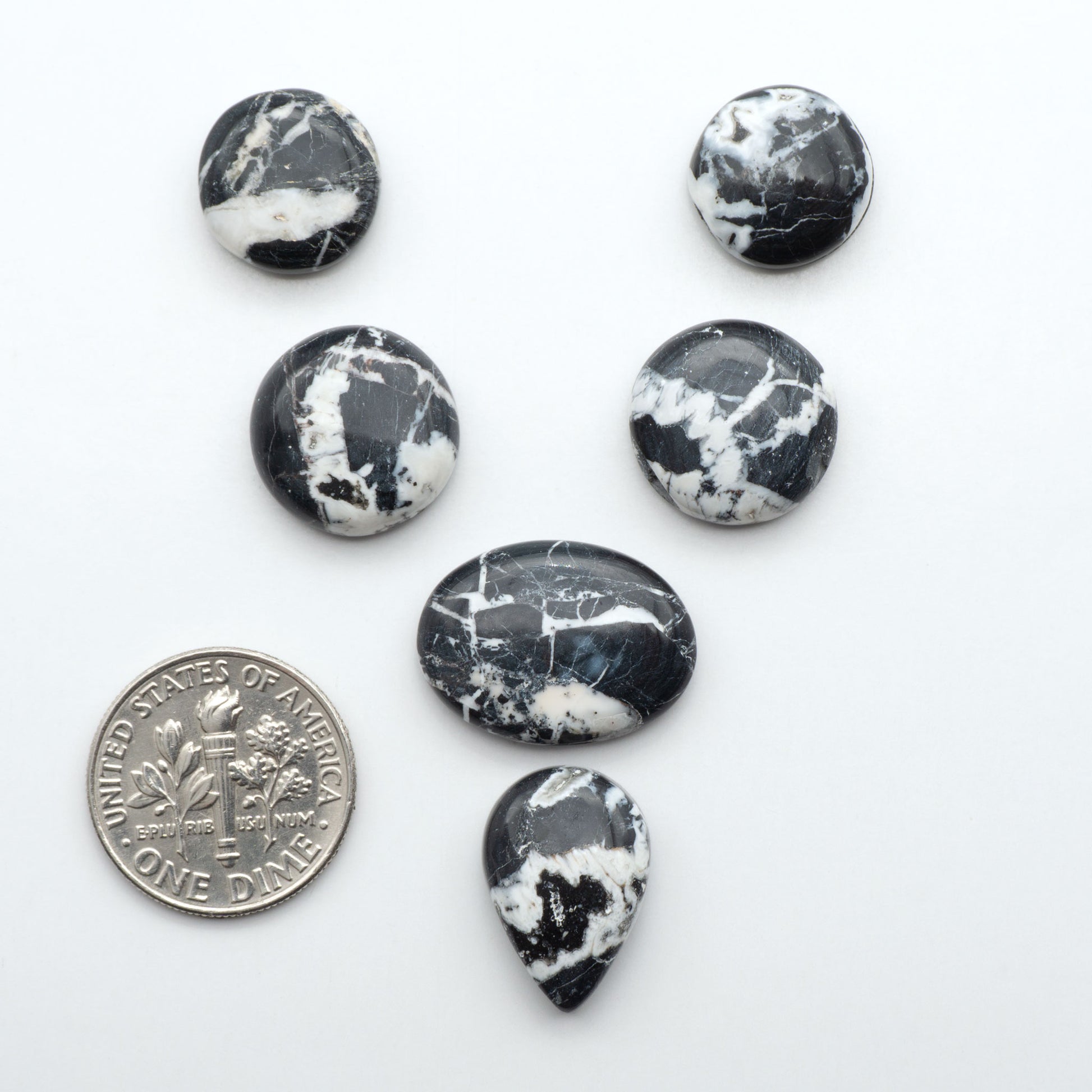 Natural White Buffalo Stone Cabochons are semi-precious gemstones cut into shapes ideal for jewelry-making, making them an excellent choice for artisans.
