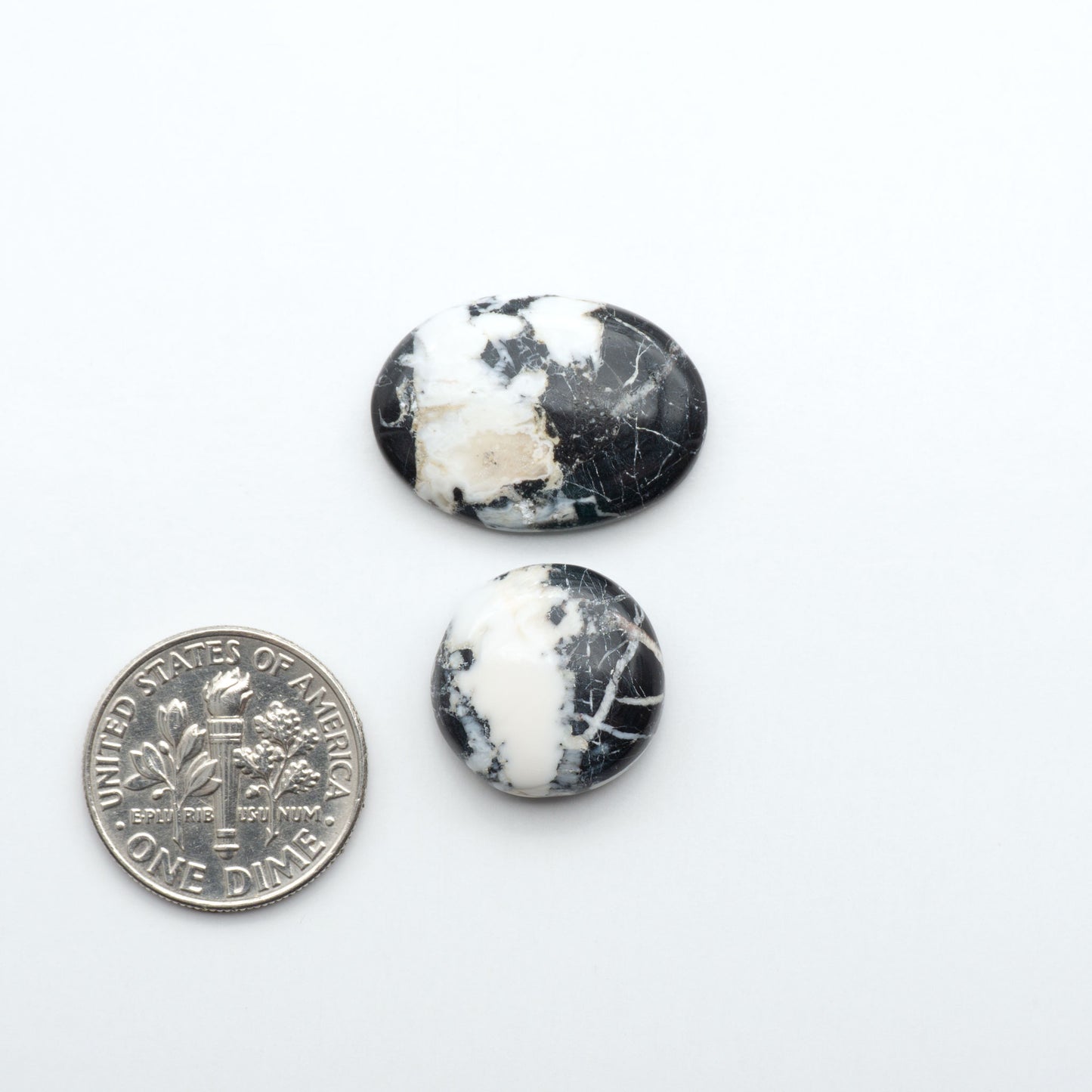 Natural White Buffalo Stone Cabochons are semi-precious gemstones cut into shapes ideal for jewelry-making, making them an excellent choice for artisans.
