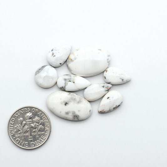Natural White Buffalo Stone Cabochons are semi-precious gemstones cut into shapes ideal for jewelry-making, making them an excellent choice for artisans.
