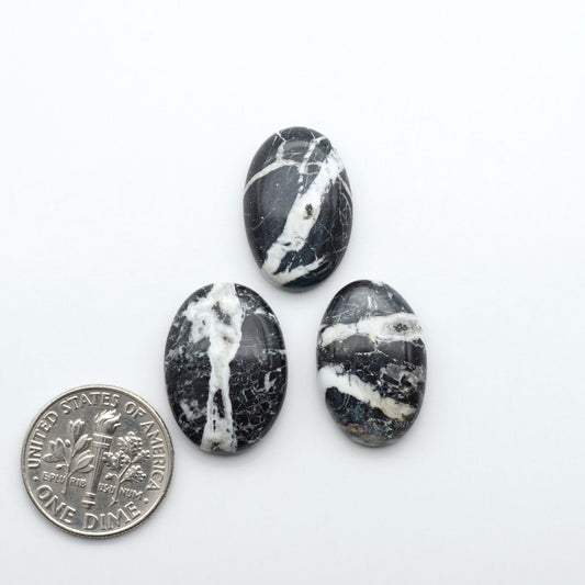 Natural White Buffalo Stone Cabochons are semi-precious gemstones cut into shapes ideal for jewelry-making, making them an excellent choice for artisans.
