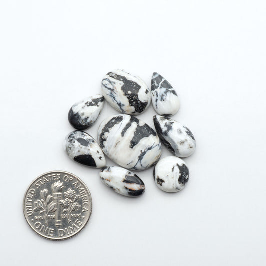 Natural White Buffalo Stone Cabochons are semi-precious gemstones cut into shapes ideal for jewelry-making, making them an excellent choice for artisans.
