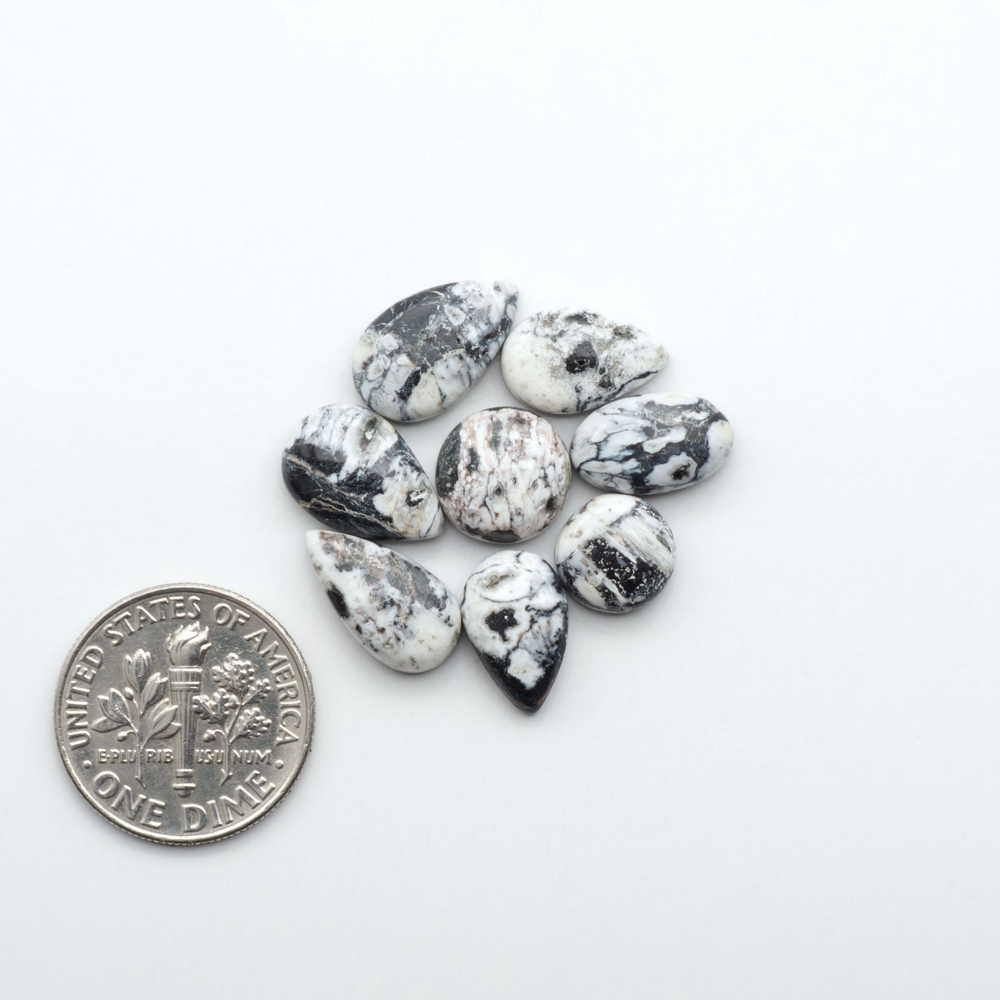 Natural White Buffalo Stone Cabochons are semi-precious gemstones cut into shapes ideal for jewelry-making, making them an excellent choice for artisans.
