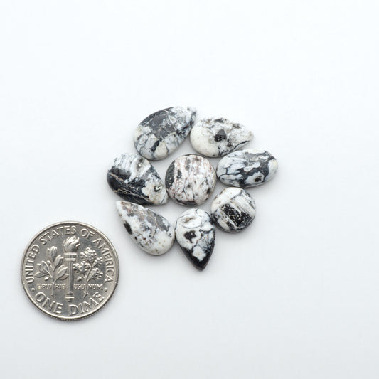 Natural White Buffalo Stone Cabochons are semi-precious gemstones cut into shapes ideal for jewelry-making, making them an excellent choice for artisans.
